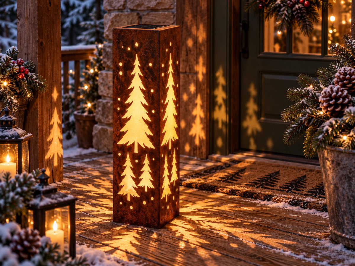 32-inch rusted evergreen tree solar steel luminary on a winter porch, view 1