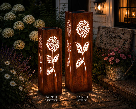 18 & 24 inch Hydrangea solar metal garden luminary set with glowing floral cutouts in a cottage garden