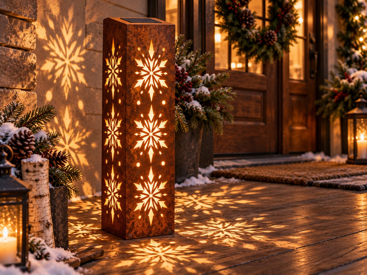 32-inch rusted steel snowflake solar luminary with three snowflakes on each side, winter porch view 2